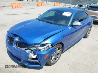 2014 BMW 2 Series M235i with VIN WBA1J7C52EVW84588, listed as a IAAI auction lot 42490194 with 103,998 mi miles and . Bid and sale history available at DreamBid. Image 2.