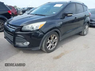 2014 Ford Escape Titanium with VIN 1FMCU0JX5EUB43194, listed as a IAAI auction lot 42084883 with 71,819 mi miles. Bid and sale history available at carsss.com. Image 2.