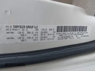 2013 Chrysler Town & Country Touring with VIN 2C4RC1BG4DR648838, listed as a IAAI auction lot 42004977 with 218,814 mi miles. Bid and sale history available at carsss.com. Image 9.