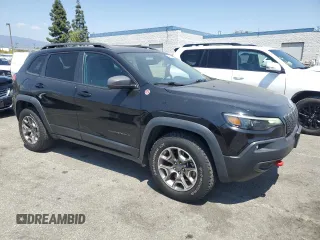 2021 Jeep Cherokee Trailhawk with VIN 1C4PJMBX8MD167153, listed as a Copart auction lot 54929845 with 52,800 mi miles and Clean title. Bid and sale history available at DreamBid. Image 4.