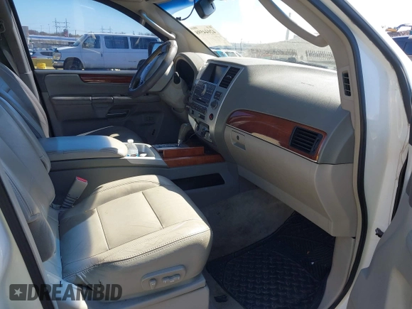 2010 Infiniti QX56 with VIN 5N3ZA0NE7AN909000, listed as a IAAI auction lot 42044598 with 284,698 mi miles. Bid and sale history available at carsss.com. Image 5.