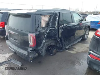 2016 GMC Yukon SLE with VIN 1GKS2AKC3GR398556, listed as a IAAI auction lot 41585972 with 130,961 mi miles. Bid and sale history available at carsss.com. Image 4.