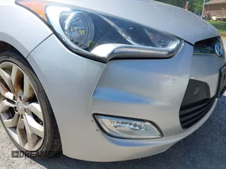 2015 Hyundai Veloster z VIN KMHTC6AD5FU240263, wystawiony jako IAAI lot #42392143 z przebiegiem 131 581 mil mil oraz . Historia ofert i sprzedaży dostępna na DreamBid. Obrazek 16.