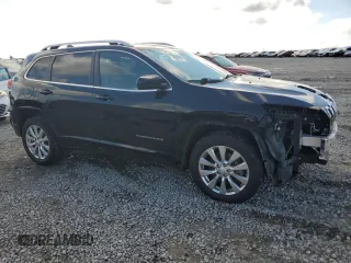 2018 Jeep Cherokee Overland with VIN 1C4PJMJX0JD594467, listed as a Copart auction lot 73963684 with 101,589 mi miles and Salvage Title. Bid and sale history available at carsss.com. Image 4.