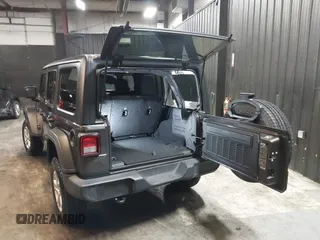2018 Jeep Wrangler Unlimited Sport S with VIN 1C4HJXDG5JW126496, listed as a IAAI auction lot 42390584 with 163,476 mi miles and . Bid and sale history available at DreamBid. Image 3.