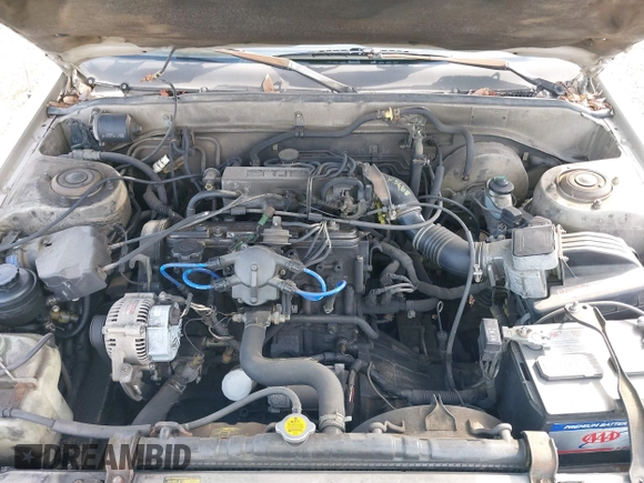 1985 Toyota Camry z VIN JT2SV16E9F0351378, wystawiony jako IAAI lot #41605627 z przebiegiem 192 476 mil mil oraz . Historia ofert i sprzedaży dostępna na DreamBid. Obrazek 6.