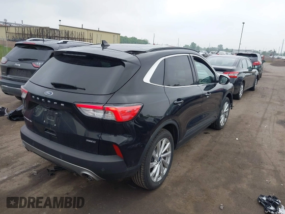 2021 Ford Escape Titanium Hybrid with VIN 1FMCU9DZ5MUA18079, listed as a IAAI auction lot 42340093 with 71,630 mi miles and . Bid and sale history available at DreamBid. Image 4.