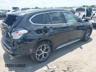 2017 BMW X1 xDrive28i with VIN WBXHT3Z30H4A65417, listed as a IAAI auction lot 42328797 with 103,788 mi miles and . Bid and sale history available at DreamBid. Image 4.