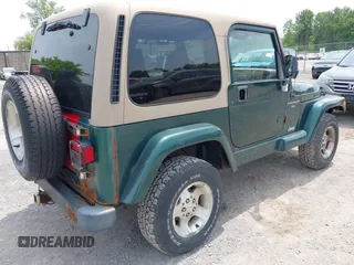 1999 Jeep Wrangler Sahara z VIN 1J4FY49S7XP442719, wystawiony jako IAAI lot #42506510 z przebiegiem 188 175 mil mil oraz . Historia ofert i sprzedaży dostępna na DreamBid. Obrazek 4.