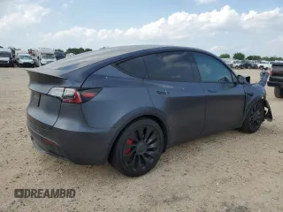 2022 Tesla Model Y Performance with VIN 7SAYGDEF2NF460730, listed as a Copart auction lot 54127945 with 59,735 mi miles and Salvage title. Bid and sale history available at DreamBid. Image 3.