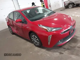 2021 Toyota Prius LE z VIN JTDL9MFU1M3025871, wystawiony jako IAAI lot #42130143 z przebiegiem 119 145 mil mil oraz . Historia ofert i sprzedaży dostępna na DreamBid. Obrazek 1.