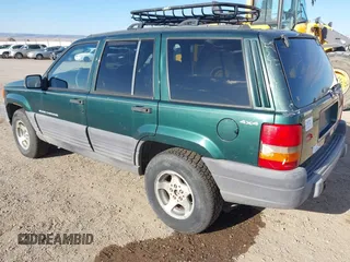 1998 Jeep Grand Cherokee Laredo with VIN 1J4GZ58S5WC362365, listed as a IAAI auction lot 41891397 with 246,673 mi miles. Bid and sale history available at carsss.com. Image 3.