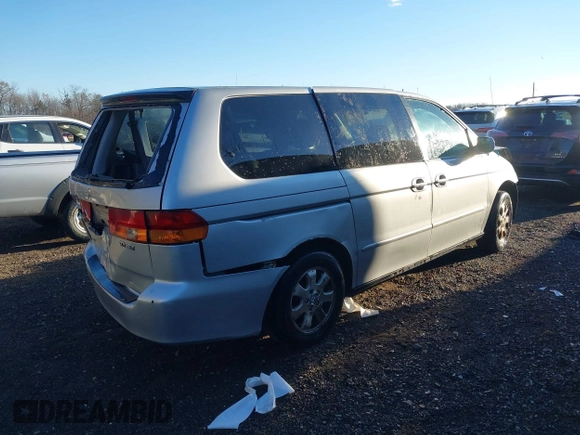 2002 Honda Odyssey EX z VIN 2HKRL18652H566576, wystawiony jako IAAI lot #40974704 z przebiegiem 232 172 mil mil oraz . Historia ofert i sprzedaży dostępna na DreamBid. Obrazek 4.