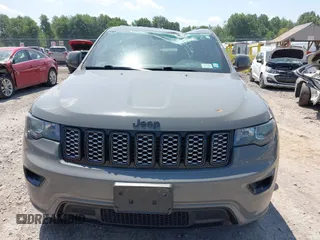 2020 Jeep Grand Cherokee Laredo E with VIN 1C4RJFAG0LC293050, listed as a IAAI auction lot 42566345 with 64,960 mi miles and . Bid and sale history available at DreamBid. Image 12.