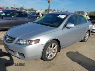 2004 Acura TSX w/Navigation with VIN JH4CL96944C002982, listed as a IAAI auction lot 41855710 with 165,129 mi miles. Bid and sale history available at carsss.com. Image 2.