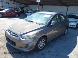 2014 Hyundai Accent GLS z VIN KMHCT4AE9EU671748, wystawiony jako IAAI lot #42356469 z przebiegiem 179 390 mil mil oraz . Historia ofert i sprzedaży dostępna na DreamBid. Obrazek 6.
