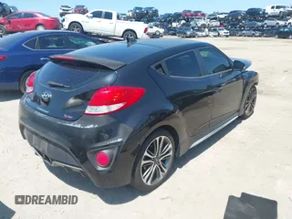 2016 Hyundai Veloster Turbo with VIN KMHTC6AE5GU281597, listed as a IAAI auction lot 42006038 with 77,642 mi miles. Bid and sale history available at carsss.com. Image 4.