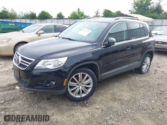 2011 Volkswagen Tiguan SEL with VIN WVGBV7AX6BW521525, listed as a IAAI auction lot 42490216 with 123,546 mi miles and . Bid and sale history available at DreamBid. Image 2.