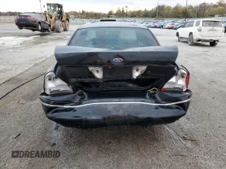 2000 Ford Crown Victoria LX z VIN 2FAFP74W3YX122481, wystawiony jako Copart lot #79189794 z przebiegiem 277 772 mil mil oraz Nie do naprawy • Non repairable. Historia ofert i sprzedaży dostępna na DreamBid. Obrazek 6.