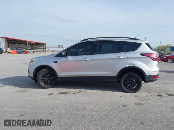 2018 Ford Escape SE z VIN 1FMCU9GD6JUC91365, wystawiony jako IAAI lot #39152113 z przebiegiem 129 283 mil mil oraz . Historia ofert i sprzedaży dostępna na DreamBid. Obrazek 14.