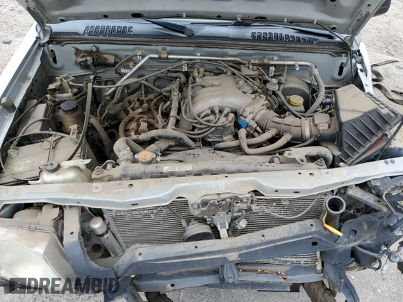 2004 Nissan Frontier XE Desert Runner with VIN 1N6ED26Y44C402138, listed as a Copart auction lot 58828425 with 125,143 mi miles and Salvage title. Bid and sale history available at DreamBid. Image 11.