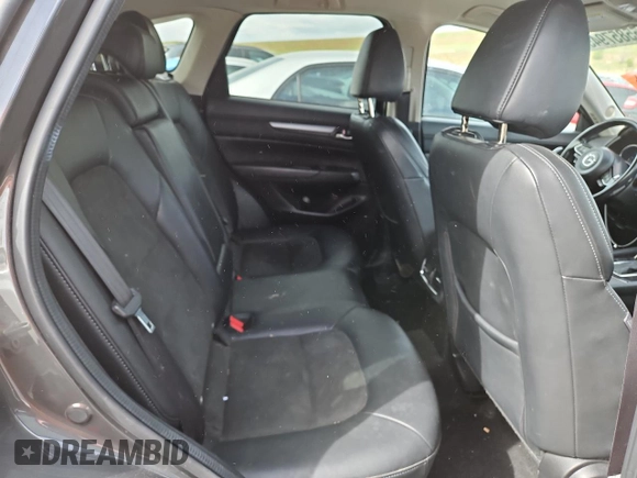 2018 Mazda CX-5 Touring z VIN JM3KFBCM4J0349687, wystawiony jako Copart lot #55857945 z przebiegiem Nie podano mil oraz Szkoda całkowita • Salvage title. Historia ofert i sprzedaży dostępna na DreamBid. Obrazek 11.