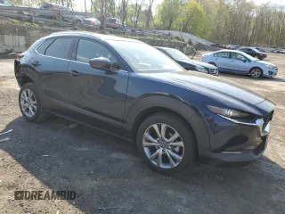 2022 Mazda CX-30 S Premium with VIN 3MVDMBDL3NM404404, listed as a Copart auction lot 54438705 with 41,311 mi miles and Salvage title. Bid and sale history available at DreamBid. Image 4.