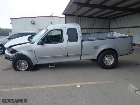 2000 Ford F-150 XL with VIN 1FTRX18L9YKA05396, listed as a IAAI auction lot 41637310 with 234,555 mi miles. Bid and sale history available at carsss.com. Image 14.