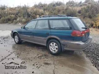 1996 Subaru Legacy Outback with VIN 4S3BG685XT7984194, listed as a Copart auction lot 77999224 with 130,804 mi miles and Salvage title. Bid and sale history available at DreamBid. Image 2.