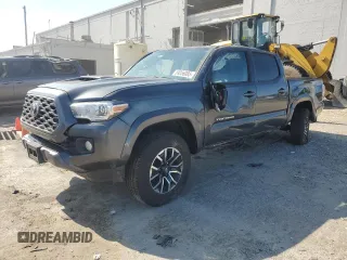 2023 Toyota Tacoma SR with VIN 3TMCZ5AN9PM619391, listed as a Copart auction lot 59056085 with 19,721 mi miles and Salvage title. Bid and sale history available at DreamBid. Image 1.