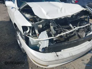 2004 Toyota Avalon XL z VIN 4T1BF28BX4U343188, wystawiony jako IAAI lot #42163107 z przebiegiem Nie podano mil oraz . Historia ofert i sprzedaży dostępna na DreamBid. Obrazek 19.