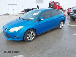 2014 Ford Focus SE with VIN 1FADP3F29EL374822, listed as a IAAI auction lot 41822631 with 221,719 mi miles. Bid and sale history available at carsss.com. Image 2.
