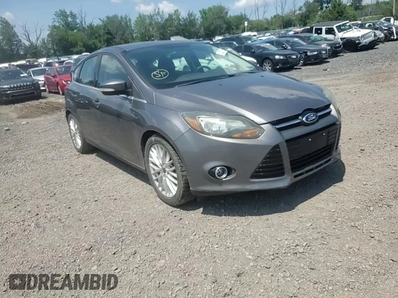 2014 Ford Focus Titanium z VIN 1FADP3N27EL462950, wystawiony jako Copart lot #65207155 z przebiegiem 34 058 mil mil oraz Szkoda całkowita • Salvage title. Historia ofert i sprzedaży dostępna na DreamBid. Obrazek 13.