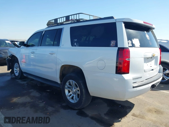 2019 Chevrolet Suburban LT with VIN 1GNSCHKC3KR143942, listed as a IAAI auction lot 41896633 with 153,139 mi miles and . Bid and sale history available at DreamBid. Image 3.