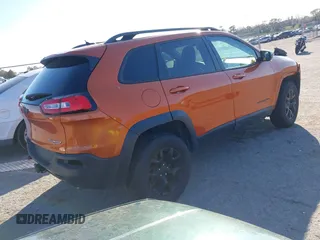 2014 Jeep Cherokee Trailhawk with VIN 1C4PJMBS4EW254879, listed as a IAAI auction lot 41550356 with 101,077 mi miles. Bid and sale history available at carsss.com. Image 4.