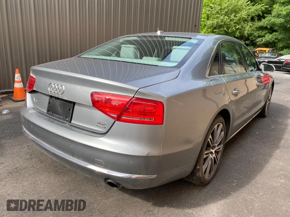 2011 Audi A8 with VIN WAURVAFD7BN018734, listed as a Copart auction lot 63735055 with 79,694 mi miles and Clean title. Bid and sale history available at DreamBid. Image 4.