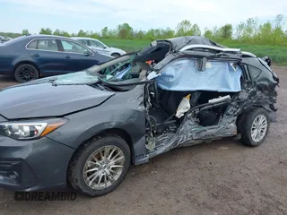 2018 Subaru Impreza Premium z VIN 4S3GTAD67J3701533, wystawiony jako IAAI lot #42157704 z przebiegiem 63 999 mil mil oraz . Historia ofert i sprzedaży dostępna na DreamBid. Obrazek 6.