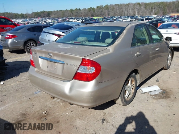 2002 Toyota Camry LE z VIN 4T1BE32K02U051709, wystawiony jako IAAI lot #41485620 z przebiegiem 232 876 mil mil oraz . Historia ofert i sprzedaży dostępna na DreamBid. Obrazek 4.