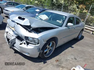 2006 Dodge Charger R/T with VIN 2B3KA53H56H513111, listed as a IAAI auction lot 41977236 with 173,048 mi miles and . Bid and sale history available at carsss.com. Image 2.