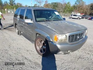 1999 Cadillac Escalade z VIN 1GYEK13R7XR409130, wystawiony jako IAAI lot #41175368 z przebiegiem 250 795 mil mil oraz . Historia ofert i sprzedaży dostępna na DreamBid. Obrazek 1.