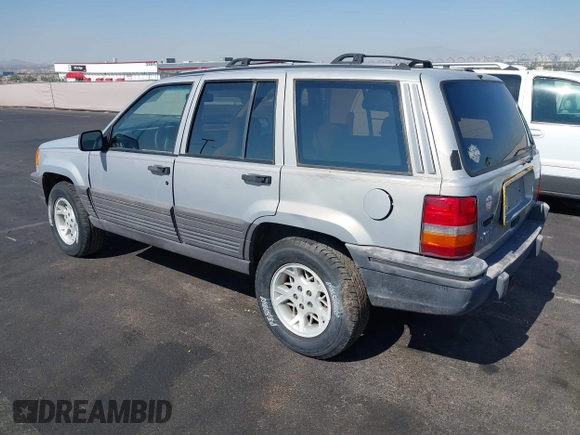 1994 Jeep Grand Cherokee Laredo with VIN 1J4GZ58S4RC325909, listed as a IAAI auction lot 39580601 with 162,952 mi miles. Bid and sale history available at carsss.com. Image 3.