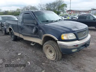 2000 Ford F-150 XL with VIN 1FTRX18L1YNA08999, listed as a IAAI auction lot 41988747 with 214,201 mi miles. Bid and sale history available at carsss.com. Image 1.