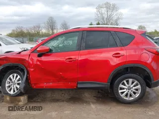 2014 Mazda CX-5 Touring z VIN JM3KE2CY3E0424892, wystawiony jako IAAI lot #42016801 z przebiegiem 173 350 mil mil oraz . Historia ofert i sprzedaży dostępna na DreamBid. Obrazek 14.