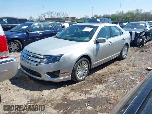 2010 Ford Fusion Hybrid z VIN 3FADP0L38AR411074, wystawiony jako IAAI lot #41928348 z przebiegiem 79 306 mil mil oraz . Historia ofert i sprzedaży dostępna na DreamBid. Obrazek 2.