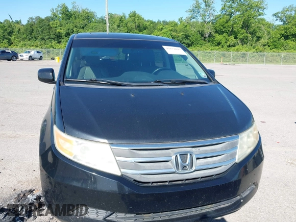 2011 Honda Odyssey EX-L with VIN 5FNRL5H66BB058333, listed as a IAAI auction lot 42172045 with 215,723 mi miles and . Bid and sale history available at carsss.com. Image 12.