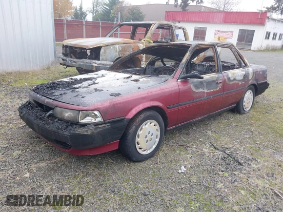 1991 Toyota Camry z VIN JT2SV21EXM3434326, wystawiony jako IAAI lot #40994388 z przebiegiem Nie podano mil oraz . Historia ofert i sprzedaży dostępna na DreamBid. Obrazek 2.