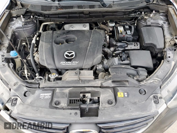 2016 Mazda CX-5 Touring z VIN JM3KE2CY7G0654292, wystawiony jako Copart lot #53433745 z przebiegiem 168 273 mil mil oraz Szkoda całkowita • Salvage title. Historia ofert i sprzedaży dostępna na DreamBid. Obrazek 12.