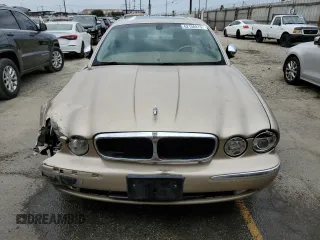 2004 Jaguar XJ with VIN SAJEA74C84SG03857, listed as a Copart auction lot 62156875 with 92,649 mi miles and Salvage title. Bid and sale history available at DreamBid. Image 5.
