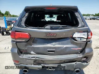 2020 Jeep Grand Cherokee Trailhawk с VIN 1C4RJFLT8LC177606, выставлен на аукционе Copart как лот 61678385 с пробегом 127 421 миль миль и Списание • Salvage title. История ставок и продаж доступна на DreamBid. Изображение 6.
