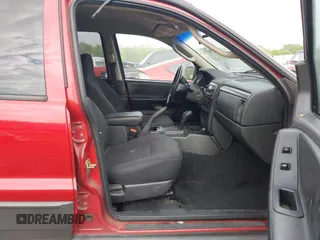 2004 Jeep Grand Cherokee Laredo with VIN 1J4GW48S64C371253, listed as a IAAI auction lot 42099607 with 260,618 mi miles. Bid and sale history available at carsss.com. Image 5.